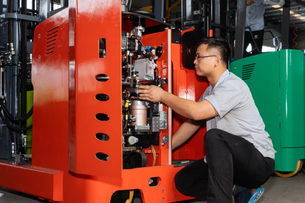 MiMA worker carefully checking the forklift inside details