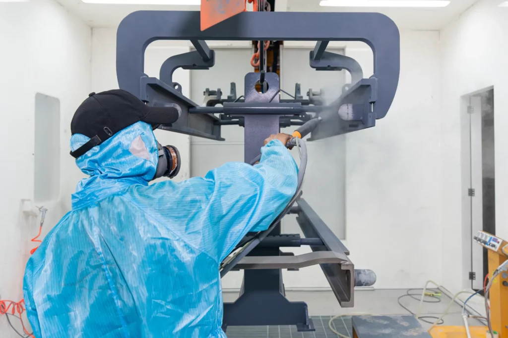 worker is painting in the paint shop